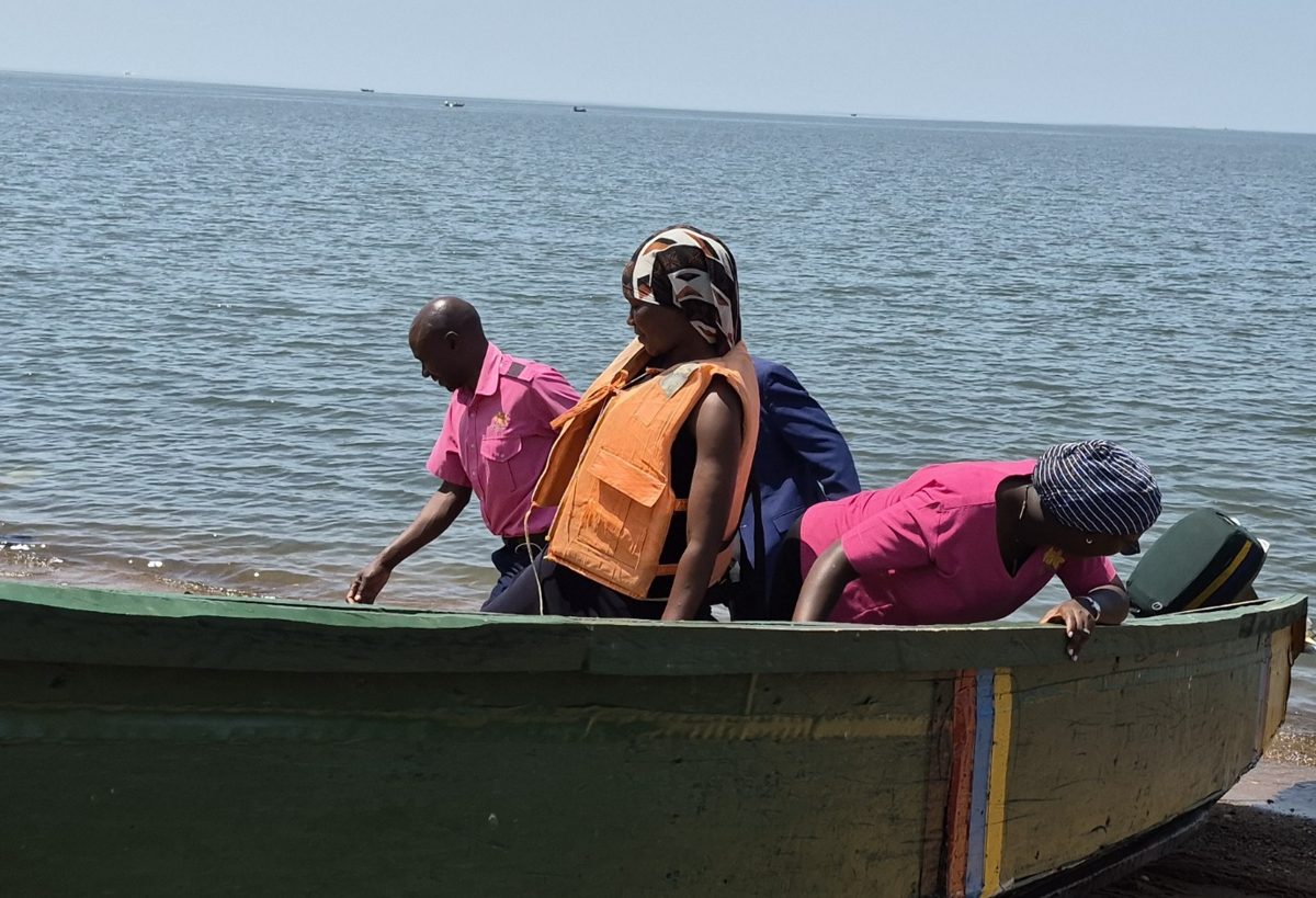 Rays of Hope Hospice Jinja team boarding a small boat on Lake Victoria to reach patients in Buvuma