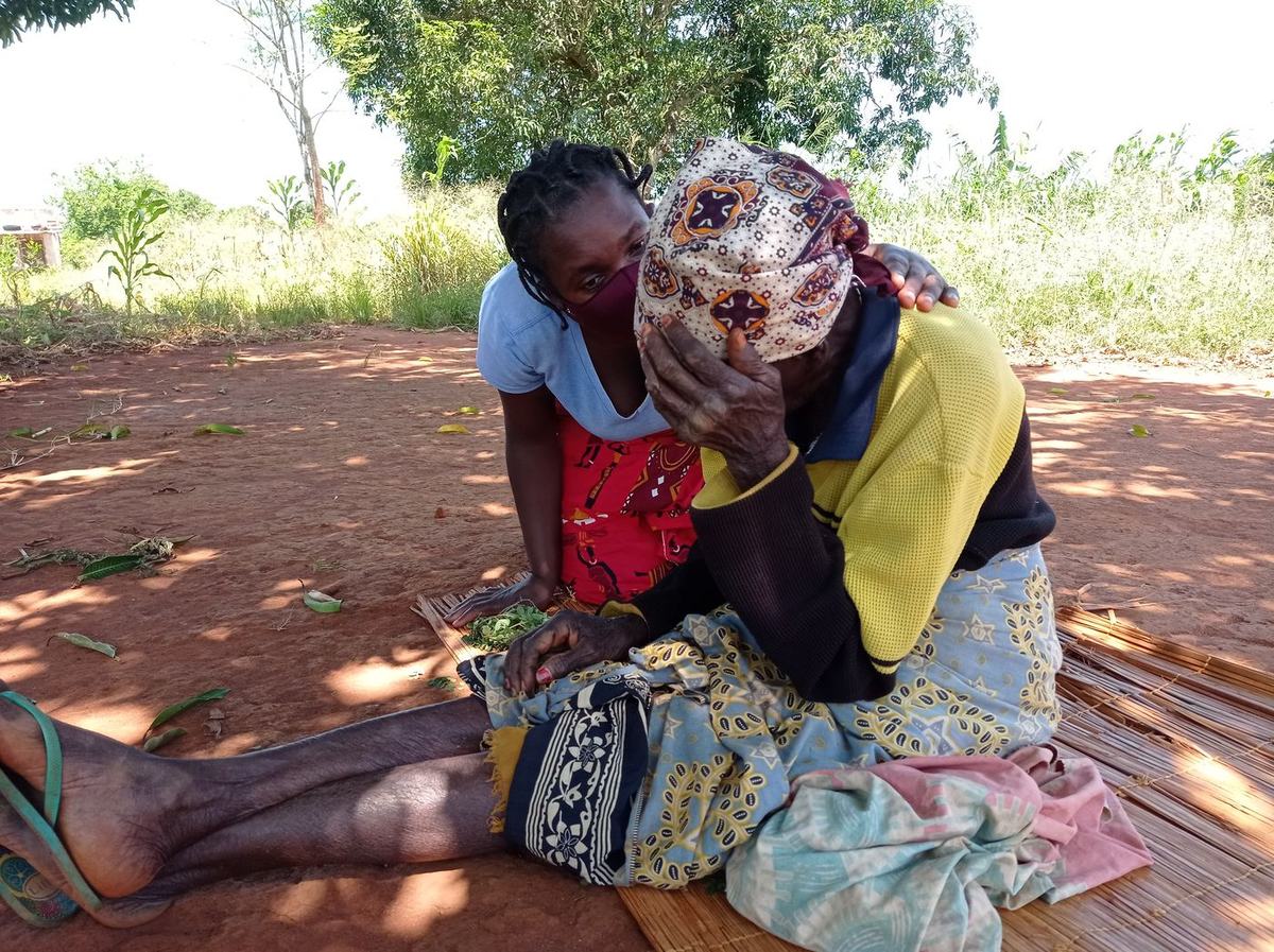 A home care worker visits a patient experiencing pain and distress, offering company and support.