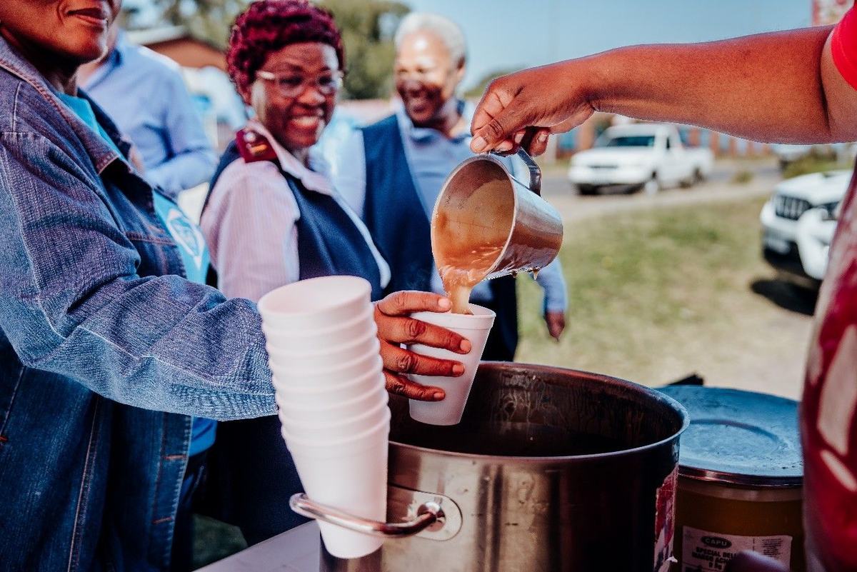 Volunteers welcome the community with soup, bread and information about palliative care in Mamelodi.