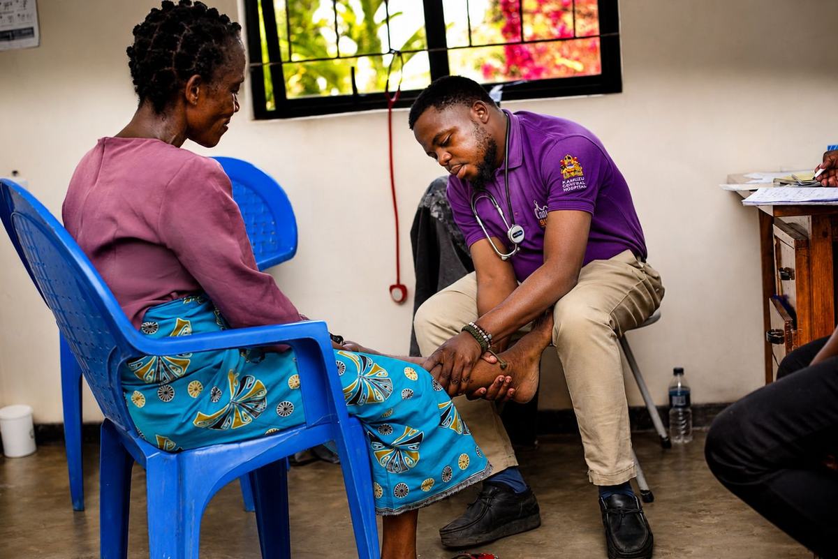 A clinician examines a patient at Ndimoyo Palliative Care Trust in Malawi.