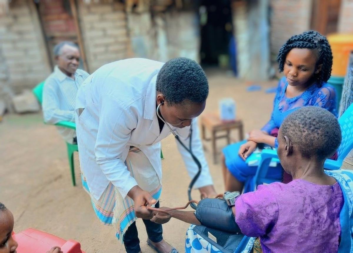 A mobile care team visits a woman living with breast cancer and hypertension.